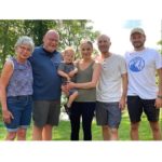 family posing outdoors