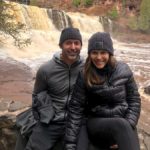 family in front of waterfall